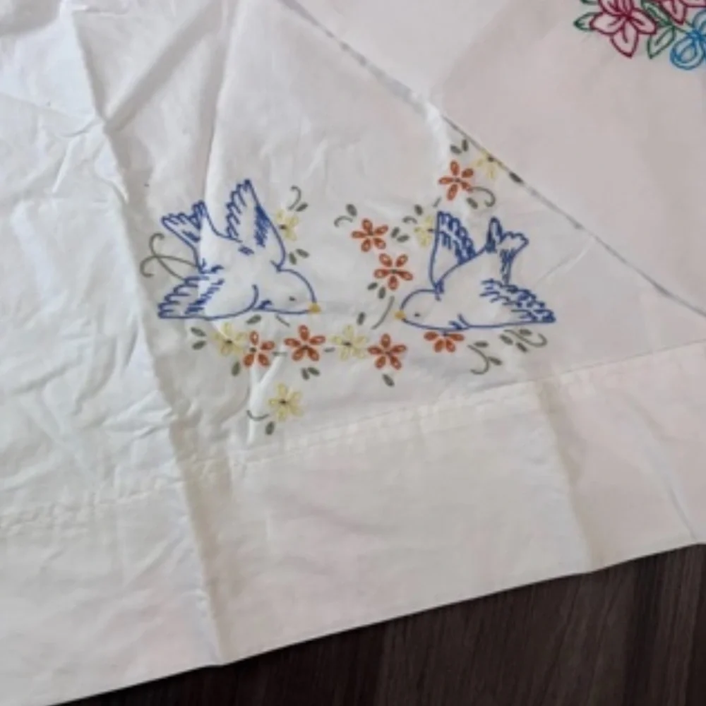Embroidered Floral and Dove Table Linen - White with Pink & Blue Accents